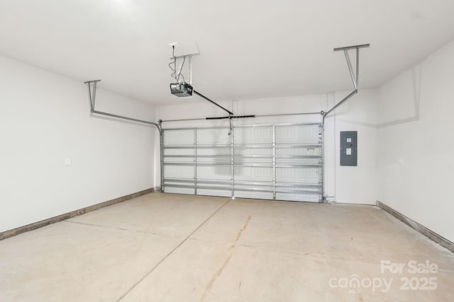 garage with a garage door opener and electric panel