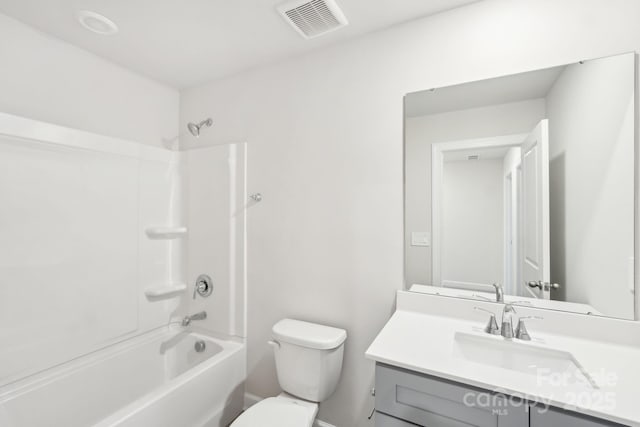 full bathroom featuring toilet, vanity, and bathtub / shower combination