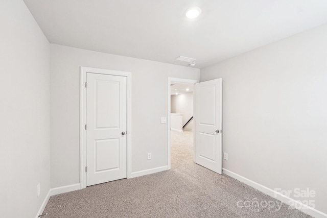 unfurnished bedroom featuring carpet