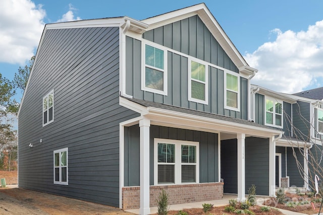 view of property exterior with covered porch