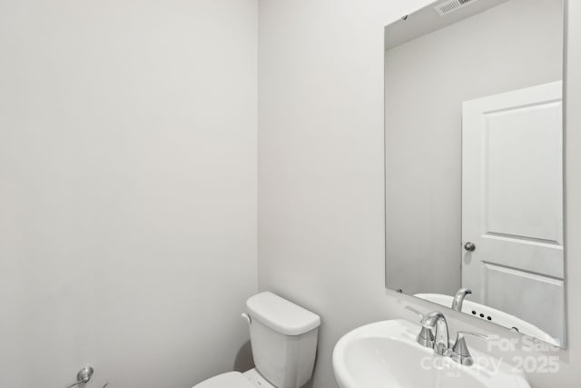 bathroom with toilet and sink