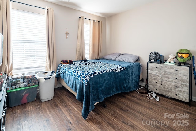 bedroom featuring dark wood-type flooring