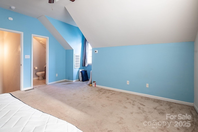 additional living space featuring carpet floors, ceiling fan, and lofted ceiling