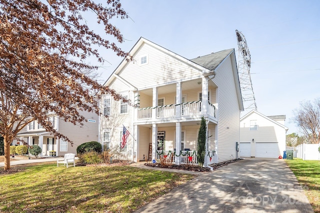 view of front of property featuring a porch, a balcony, a front lawn, central AC unit, and a garage