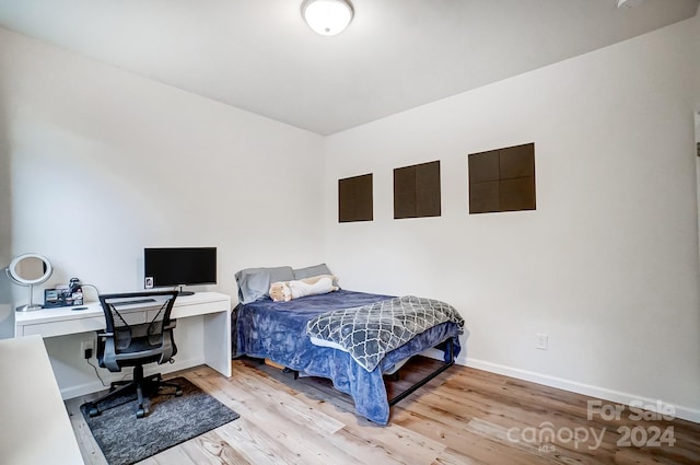 bedroom with light wood-type flooring