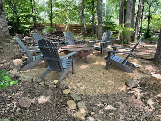 view of yard with a fire pit