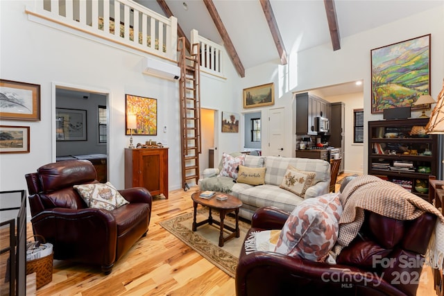 living room with beam ceiling, light hardwood / wood-style floors, and high vaulted ceiling