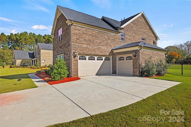 view of home's exterior featuring a garage and a yard