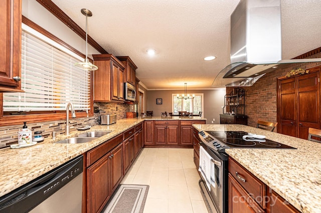 kitchen with sink, appliances with stainless steel finishes, ornamental molding, range hood, and pendant lighting