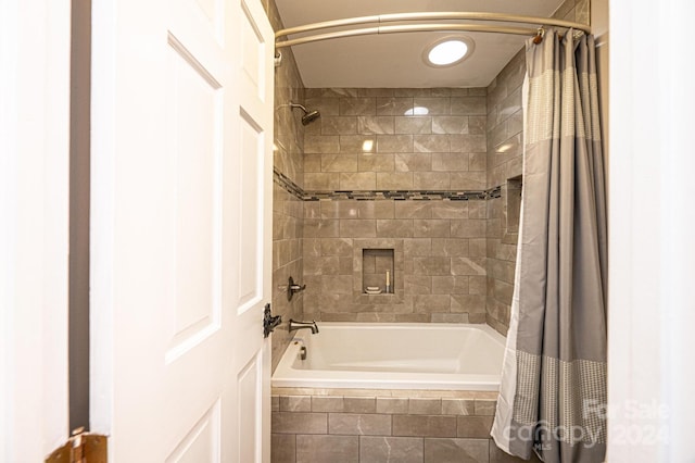 bathroom featuring shower / bath combination with curtain