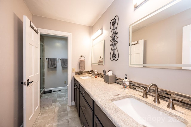 bathroom featuring backsplash, vanity, tile patterned flooring, and a shower with door