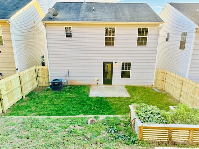 back of house with a lawn, cooling unit, and a patio