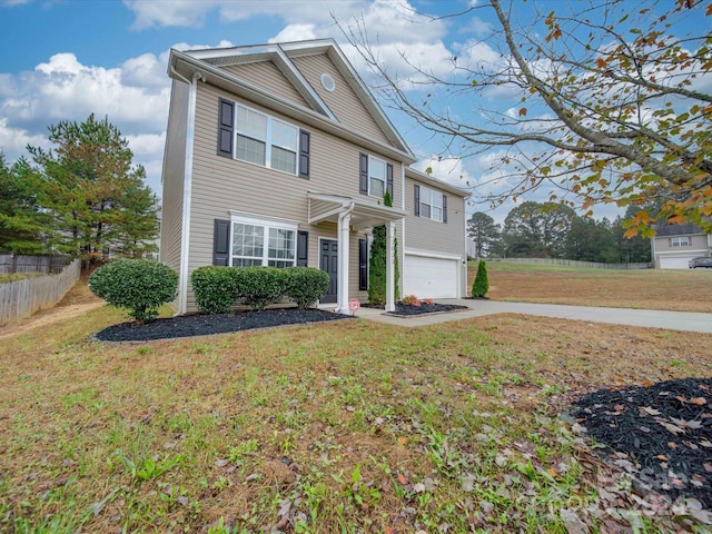 view of front of property with a garage and a front yard