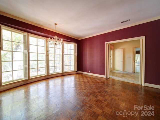 unfurnished room with dark parquet flooring, an inviting chandelier, and crown molding