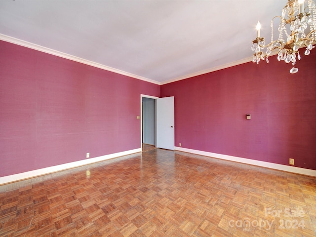 unfurnished room with parquet floors, crown molding, and a chandelier