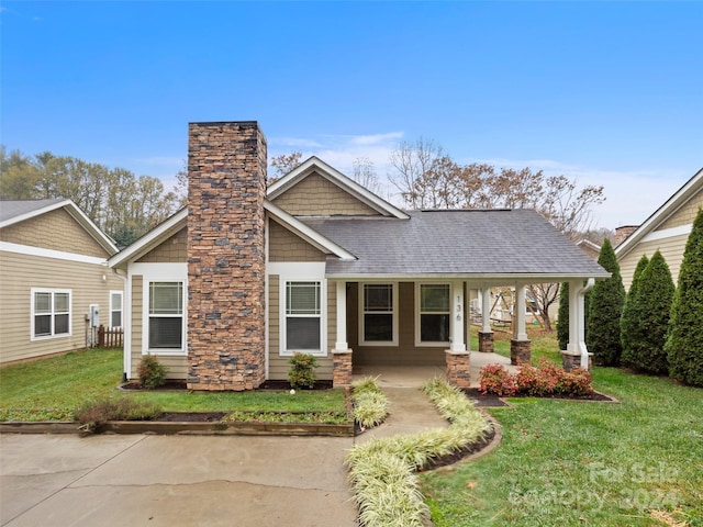 view of front of home with a front lawn and a porch