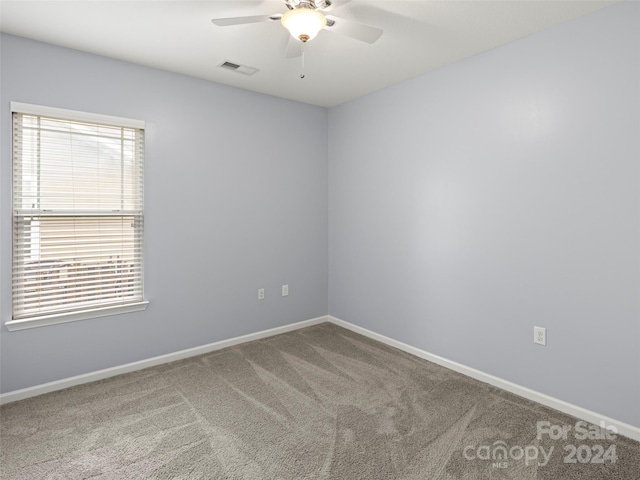 carpeted empty room with ceiling fan