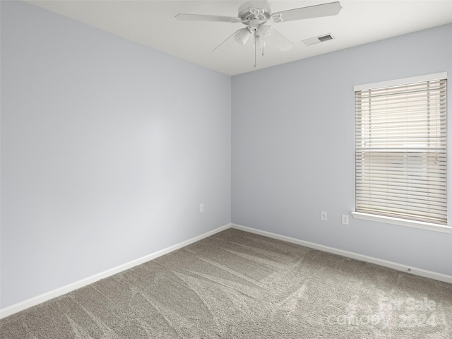 carpeted empty room with ceiling fan