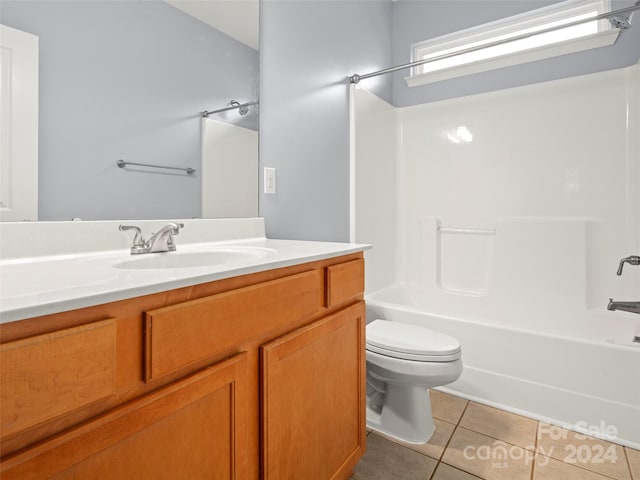 full bathroom featuring vanity, tile patterned flooring, toilet, and shower / bath combination