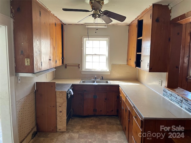 kitchen featuring ceiling fan and sink