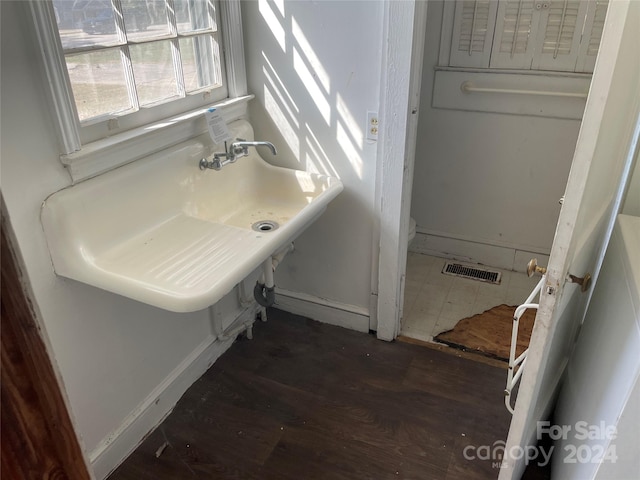 bathroom with hardwood / wood-style flooring