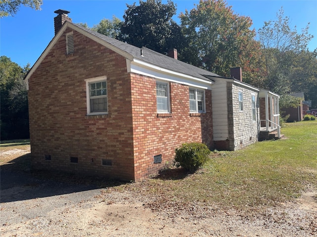 view of property exterior with a yard