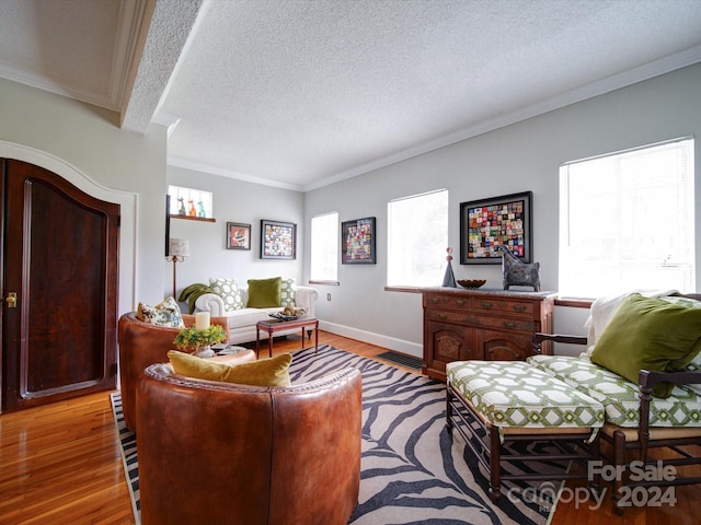 1116 E Franklin Blvd, Gastonia, NC 28054 - living room with light wood-style flooring, crown molding, and a textured ceiling