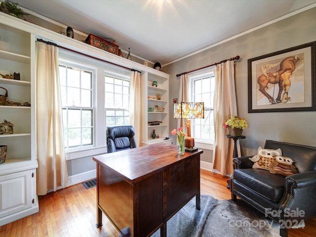 office with light wood-type flooring