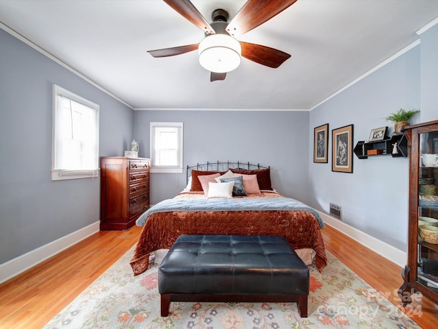 1116 E Franklin Blvd, Gastonia, NC 28054 - bedroom with ornamental molding, wood finished floors, and ceiling fan