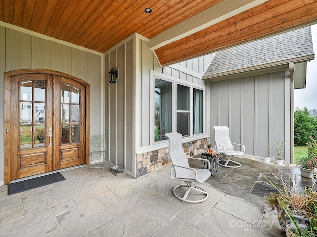 property entrance with french doors and a patio area