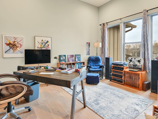 office with light hardwood / wood-style flooring