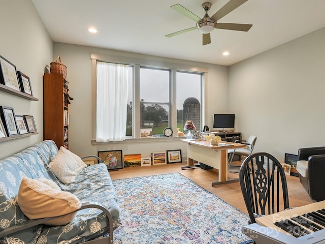 office space featuring ceiling fan and light wood-type flooring