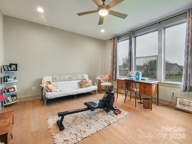 interior space featuring a wealth of natural light, ceiling fan, and light wood-type flooring