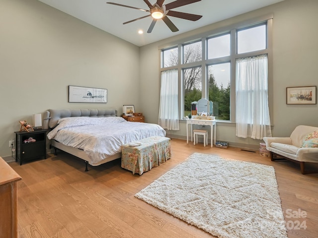 bedroom with light wood-type flooring and ceiling fan