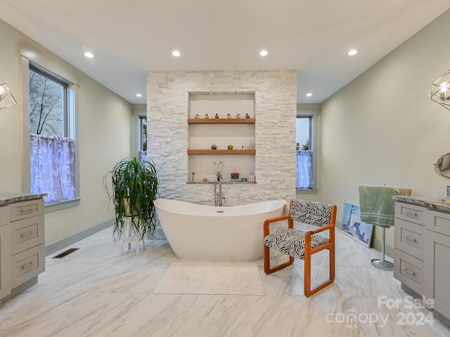 bathroom featuring a washtub