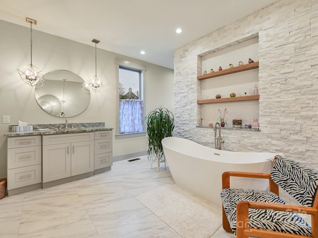 bathroom featuring vanity and a bathing tub