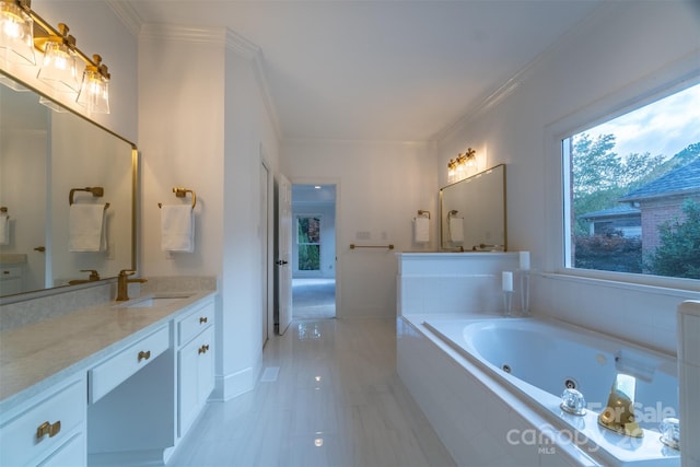 bathroom with vanity, tiled bath, and crown molding