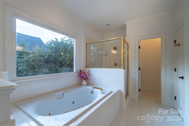 bathroom featuring shower with separate bathtub, a wealth of natural light, and crown molding