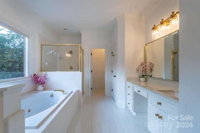 bathroom with vanity, ornamental molding, and shower with separate bathtub