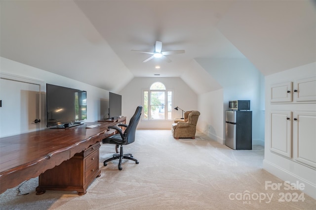 carpeted office space with ceiling fan and lofted ceiling