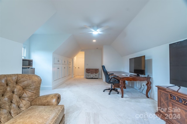 carpeted home office with vaulted ceiling and ceiling fan