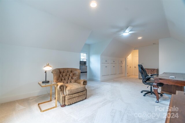 home office with ceiling fan, carpet, and lofted ceiling