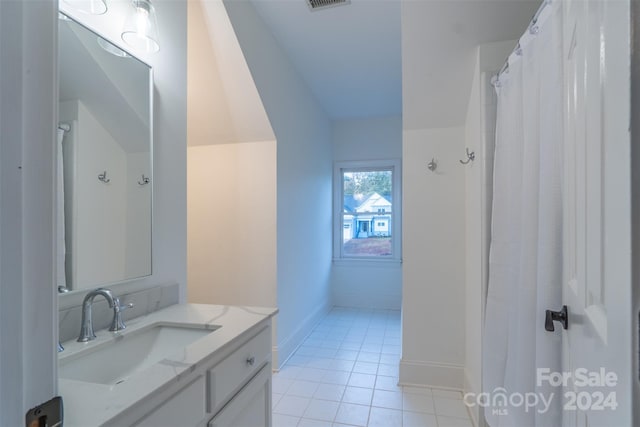 bathroom featuring vanity and tile patterned flooring