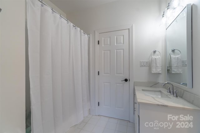 bathroom featuring vanity and tile patterned flooring