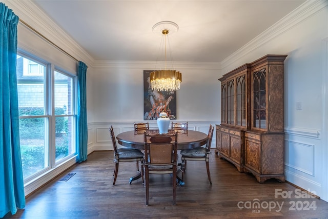 dining space featuring a chandelier, ornamental molding, a wealth of natural light, and dark wood-type flooring