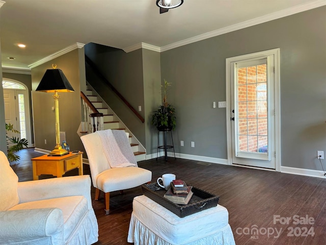 living room with ornamental molding and dark hardwood / wood-style floors