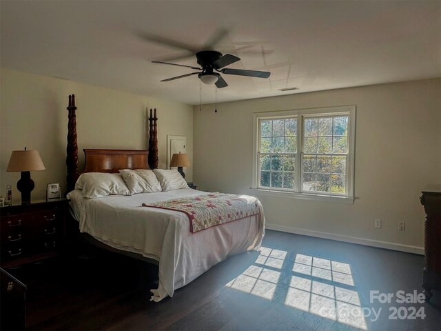 bedroom featuring ceiling fan and dark hardwood / wood-style floors