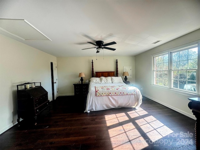 bedroom with dark wood-type flooring and ceiling fan