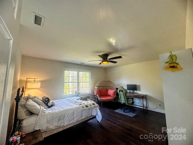 bedroom featuring dark wood-type flooring and ceiling fan