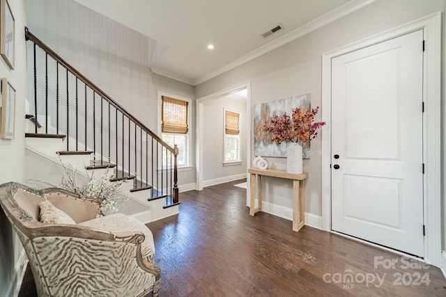 entryway featuring dark hardwood / wood-style flooring and crown molding